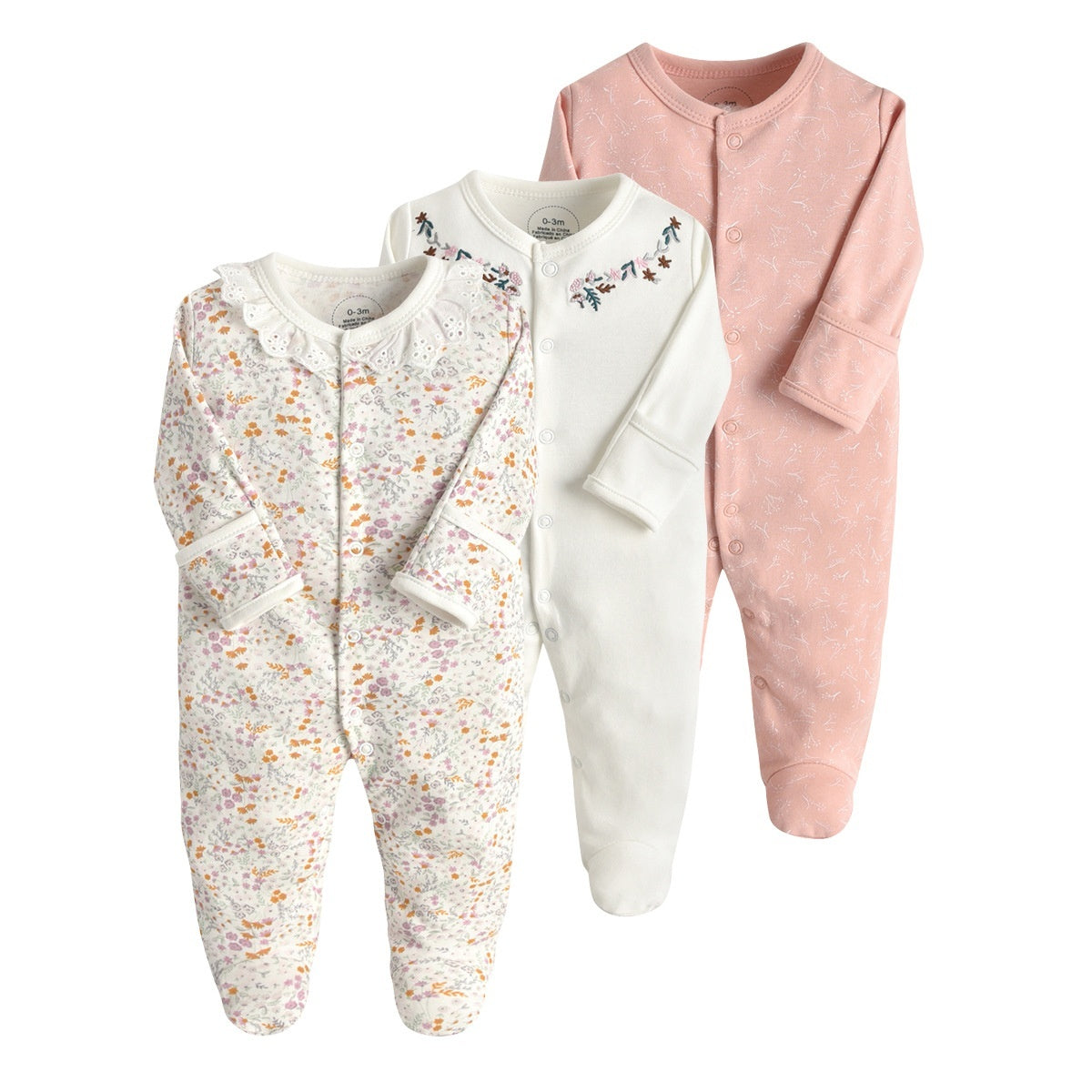 Drie nieuwe baby rompertjes met lange mouwen en voetjes